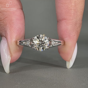 3 stone engagement ring in white gold with split band design.
