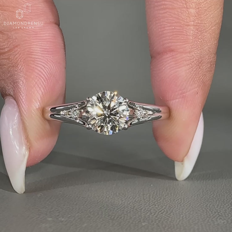 3 stone engagement ring in white gold with split band design.

