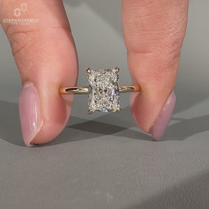 Handmade radiant cut diamond ring in solitaire style.