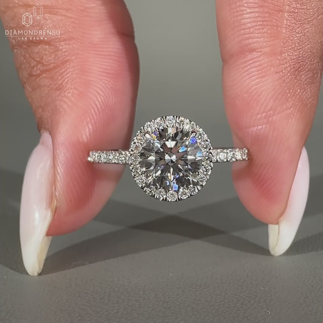 White gold round cut pave engagement ring.
