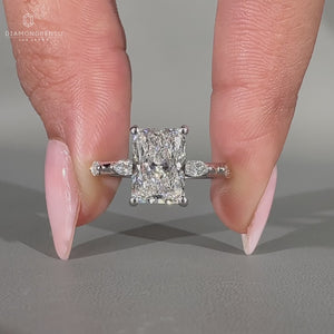 Hidden halo engagement ring with radiant cut centre stone.