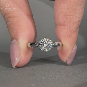 Round diamond ring pinched shank six claw prong set.
