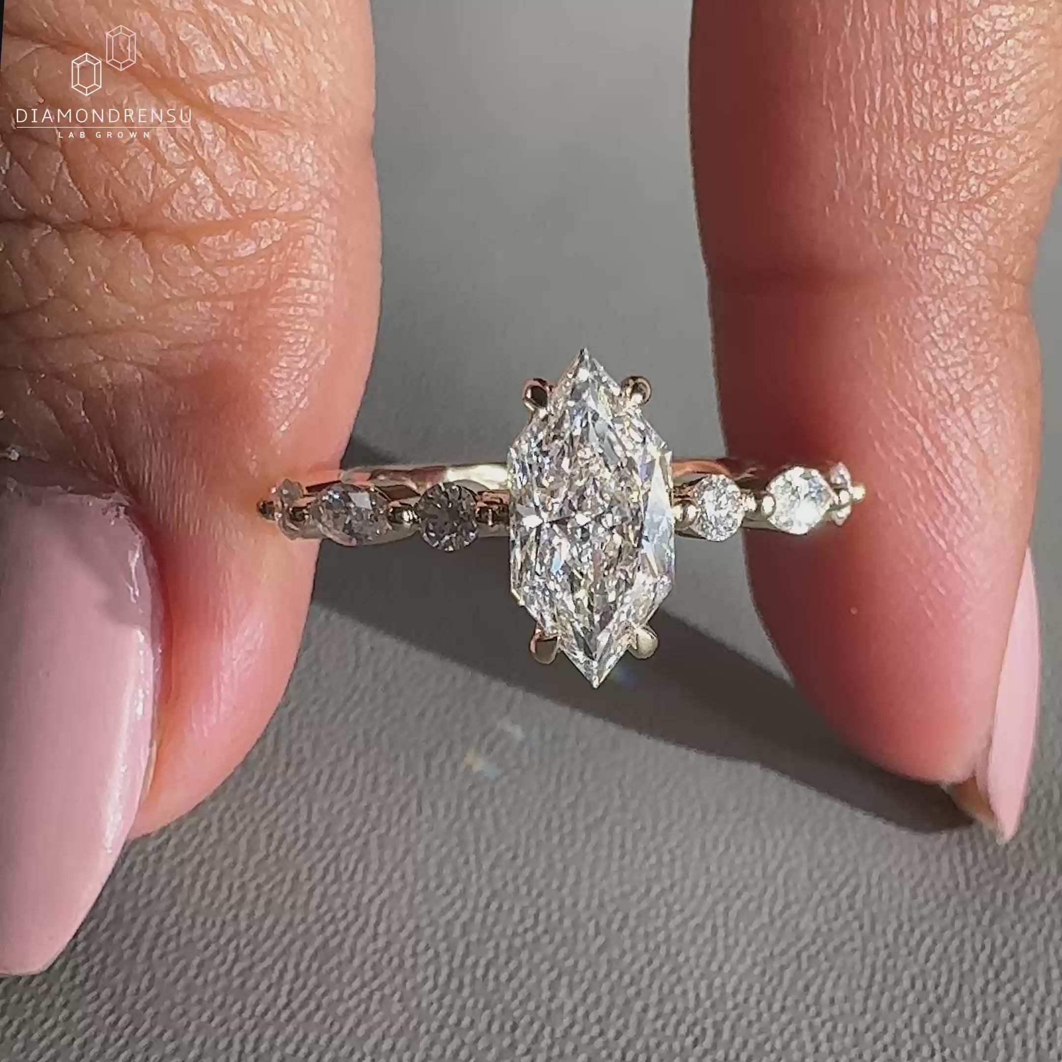 round and marquise side stones in shared prong style.
