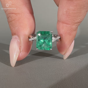 Handmade emerald cut ring with emerald gemstone centre.
