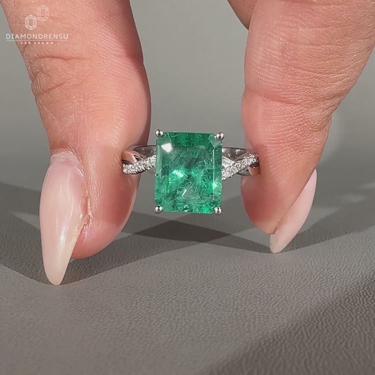 Handmade emerald cut ring with emerald gemstone centre.
