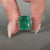 Emerald gemstone ring marquise round pave prong set.
