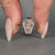 Coffin diamond ring solitaire bezel setting style.