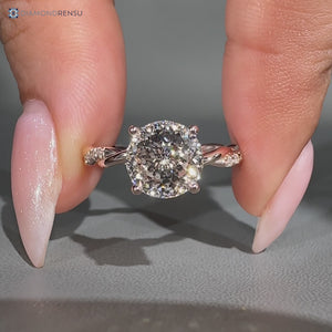 Portuguese diamond ring with round diamond halo.