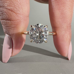 solitaire engagement ring in 4 claw prong setting.
