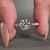 tapered pave engagement ring in white gold design.
