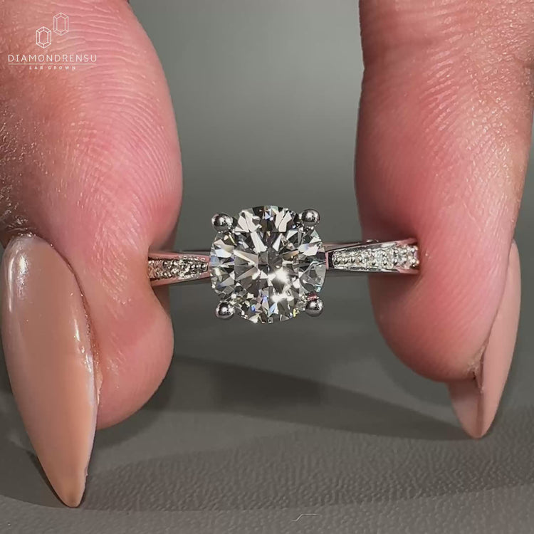 tapered pave engagement ring in white gold design.
