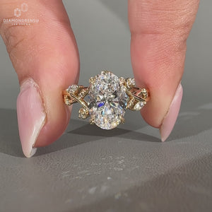 Oval diamond ring nature cluster twisted shank style.
