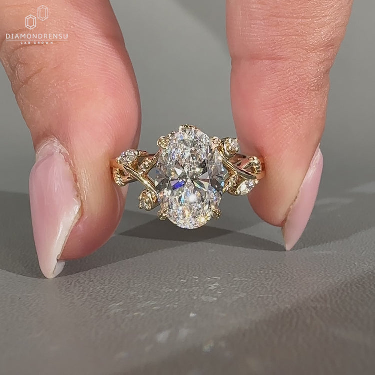 Oval diamond ring nature cluster twisted shank style.
