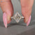 Marquise diamond ring with seven stone style.