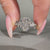 Coffin shaped diamond ring with Marquise & Round side stones.