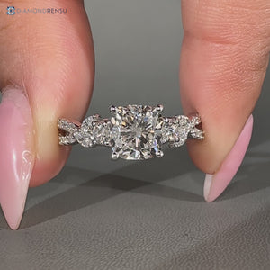 Cushion diamond ring twisted pave cluster style.