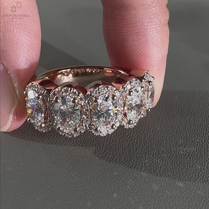 round halo engagement ring with five stone detail.
