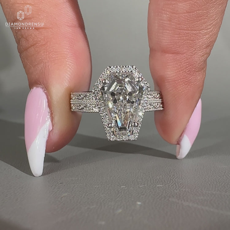 Coffin cut ring double row pave halo milgrain style.

