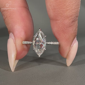 Marquise rose cut engagement ring in tapered shank band.
