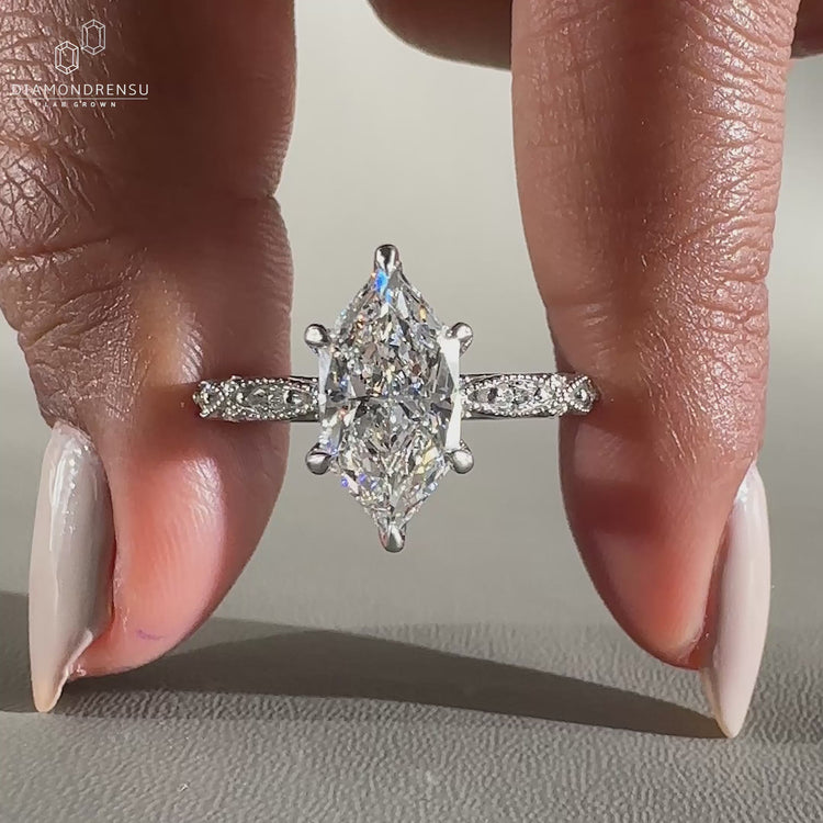 marquise shape outline in white gold engagement ring.
