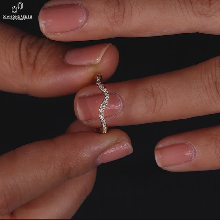 Curvy wedding band and yellow gold wedding band.
