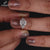 Trillion cut side stones ring set in 3 stone diamond ring.

