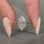 Marquise diamond ring solitaire cathedral tapered shank.

