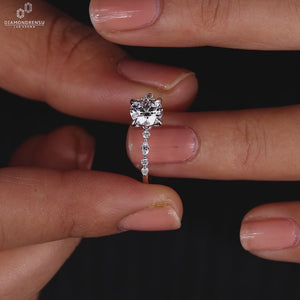 Marquise and round side stones add detail to this design.
