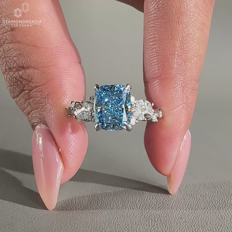 Elongated cushion cut diamond ring in a classic setting.
