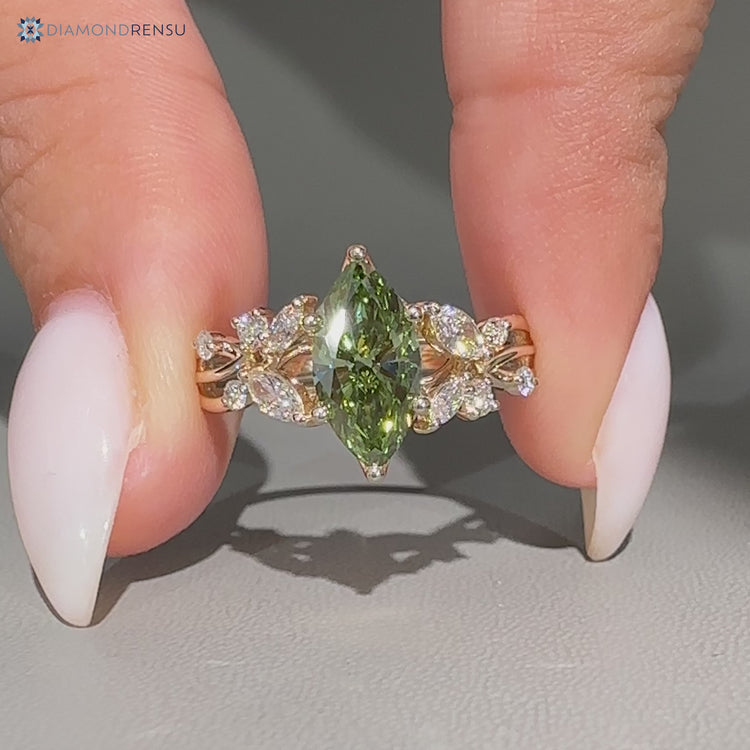 Marquise diamond ring with cluster setting.