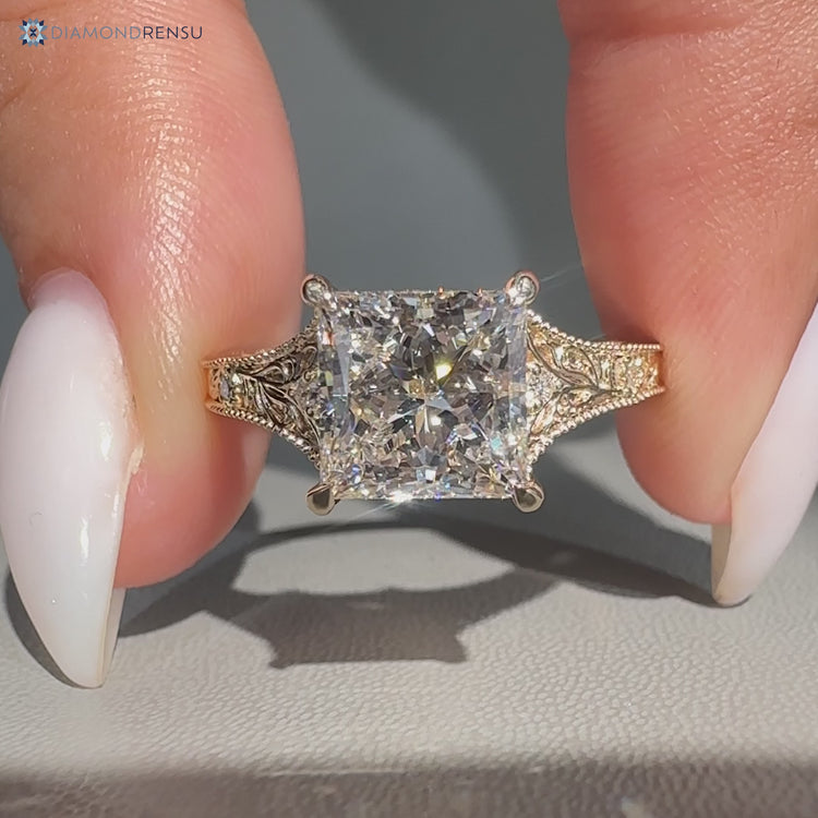 Vintage princess cut diamond ring with milgrain details.