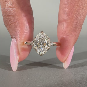 Oval diamond ring three stone tapered shank cathedral.
