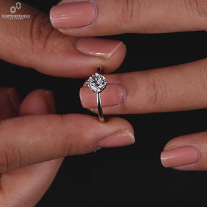 Round diamond ring crafted with a polished finish.
