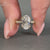 Handmade oval cut hidden halo engagement ring.
