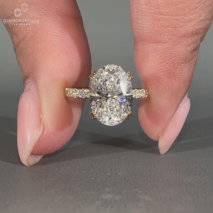 Handmade oval cut hidden halo engagement ring.
