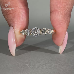 Round diamond wedding band with prong setting.
