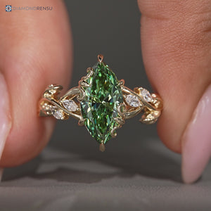 Green diamond marquise ring with nature inspired design.