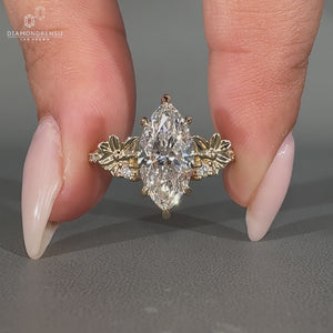 Marquise diamond ring with pave round diamond nature.