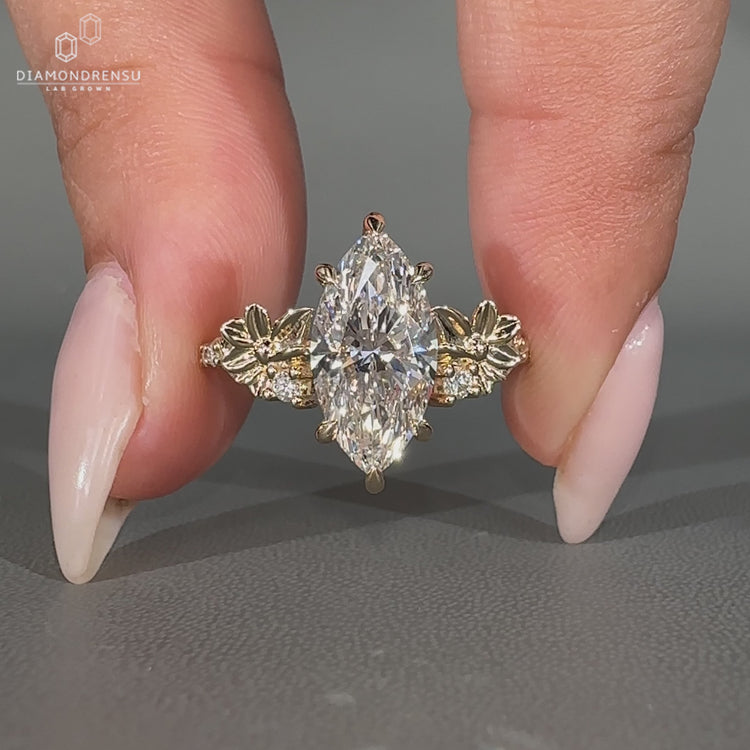 Marquise diamond ring with pave round diamond nature.