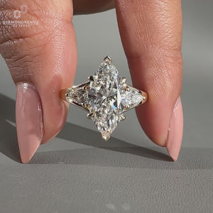 Marquise engagement ring with pear side stone.
