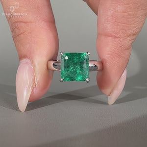 Asscher emerald ring cathedral four claw prong setting.
