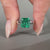 Asscher emerald ring cathedral four claw prong setting.
