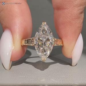 Marquise diamond ring with fishtail prong setting.