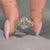 Oval diamond ring marquise and round side stones.