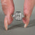 3 stone diamond ring set with Trillion cut side stone.
