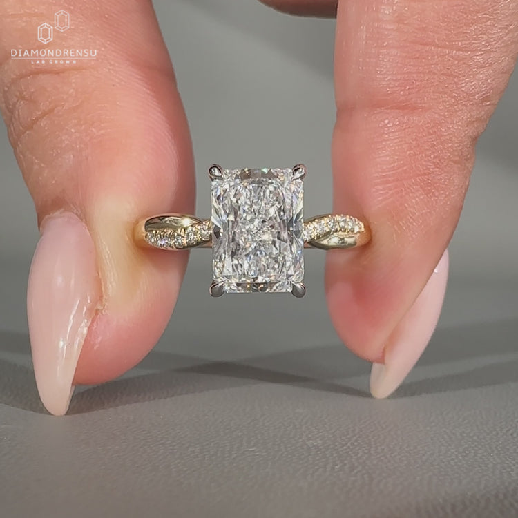 Handmade radiant cut diamond ring with twisted shank.
