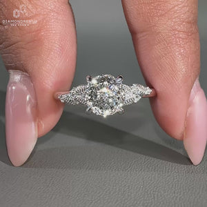 Nature inspired engagement ring with Portuguese cut diamond centre.

