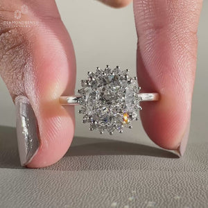 Halo diamond engagement ring in double prong setting ring.
