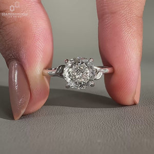 Solitaire engagement ring set in a white gold ring.
