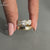 marquise and round diamond ring in open finger style.
